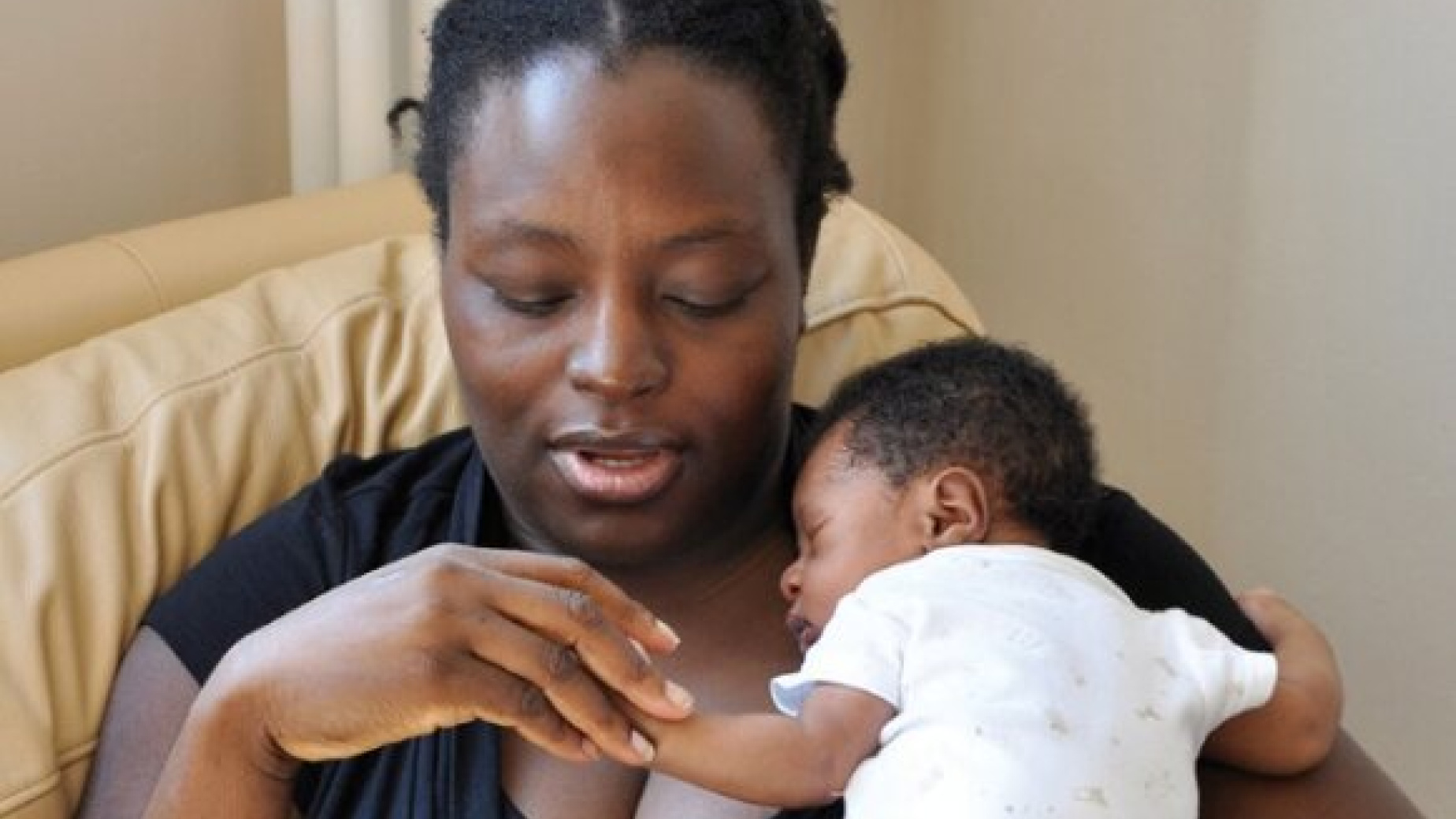 Newham mother holding a 2 week old baby