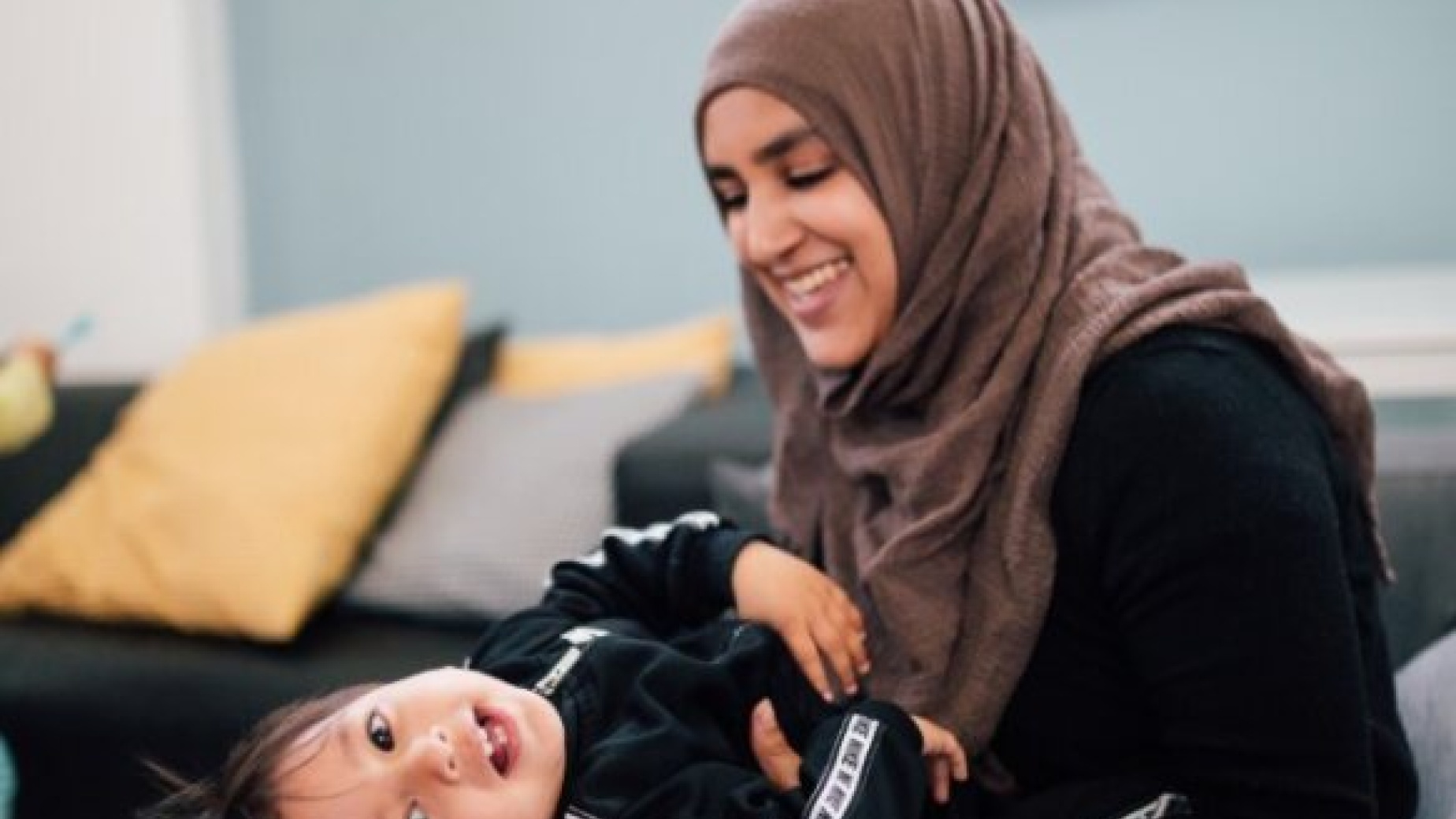 Newham mother playing with toddler son