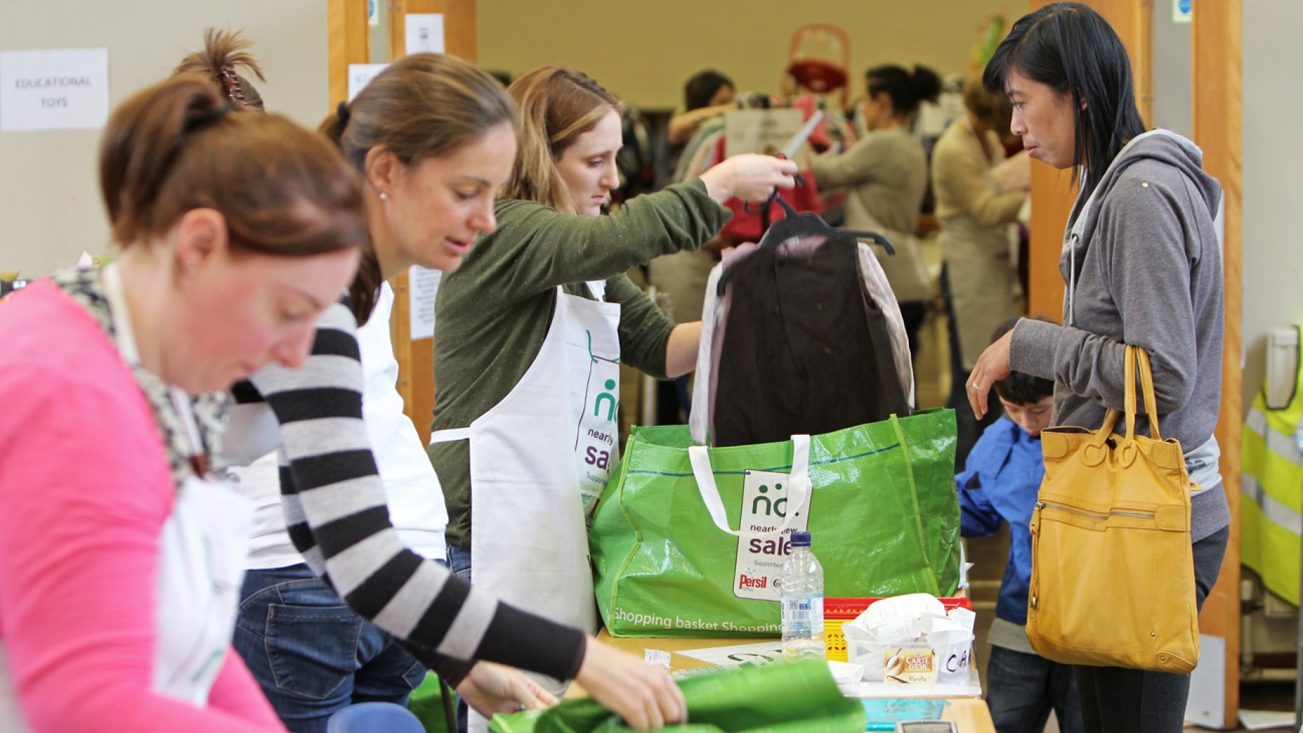 Volunteers at Nearly New Sale selling items