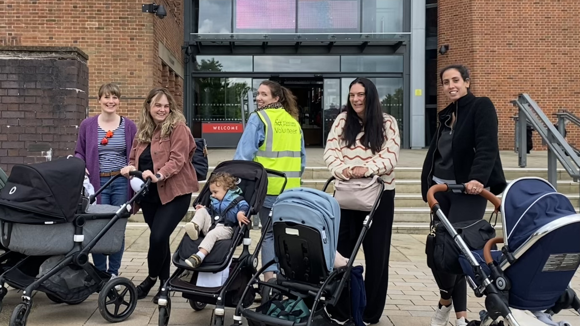 NCT volunteer with mums and babies in prams at a Walk & Talk event
