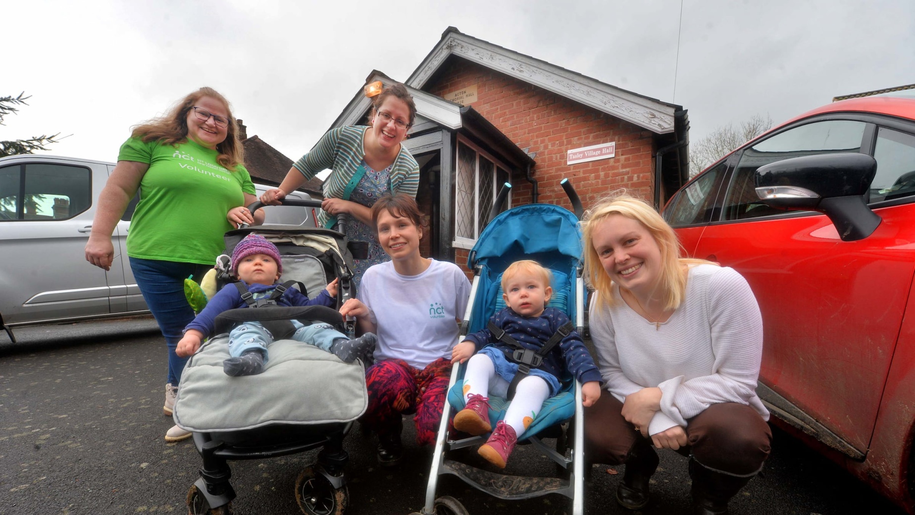 Two volunteers with parents on a Walk and Talk