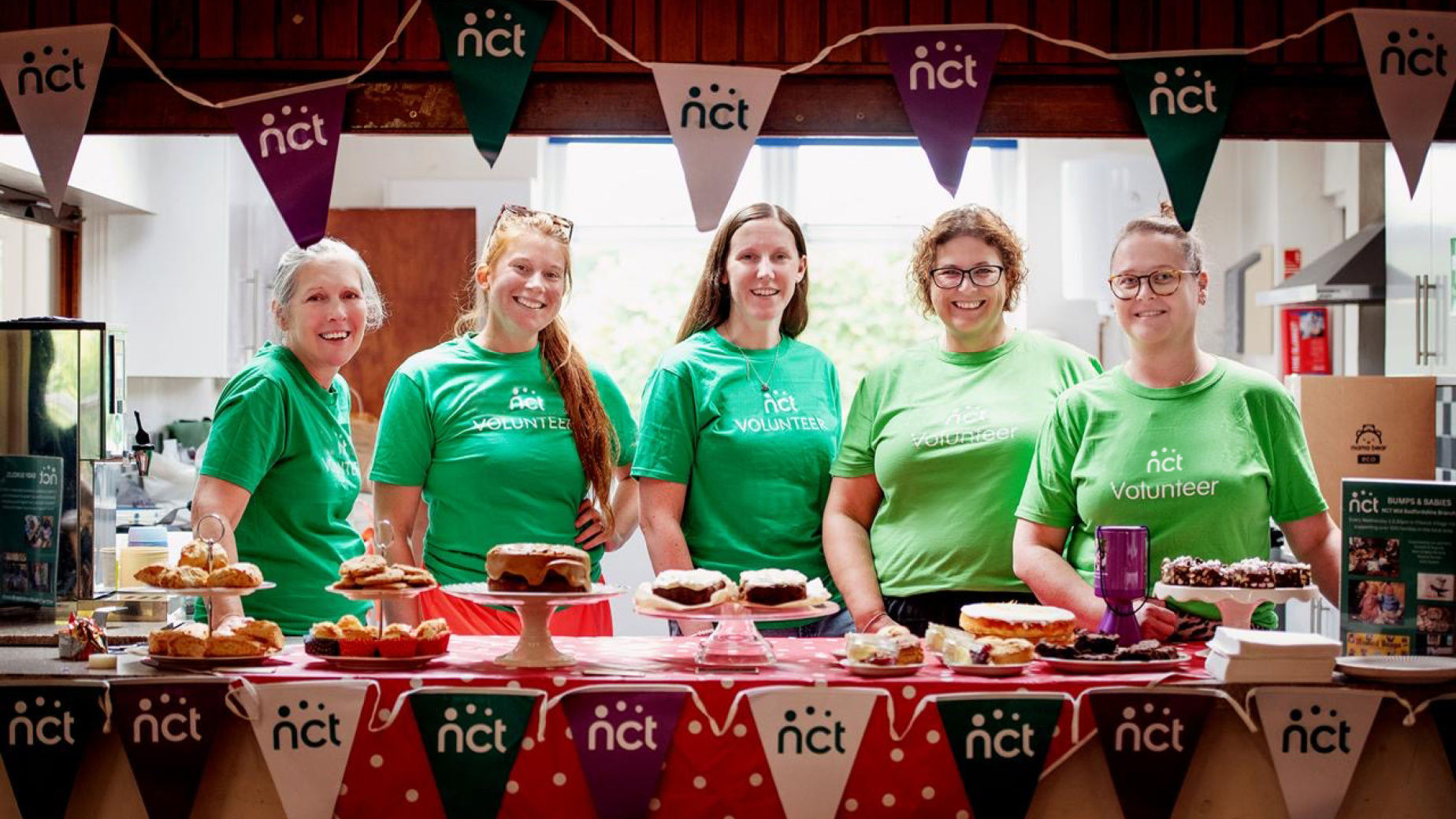 A group of volunteers with NCT branding