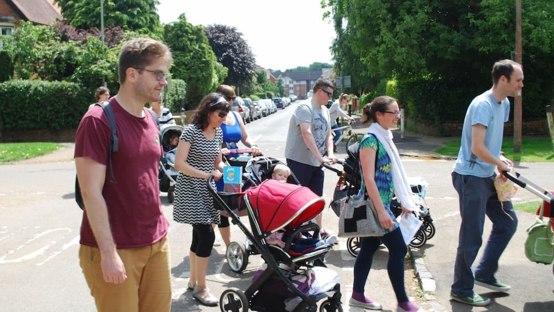 Parents pushing buggies on a walk and talk