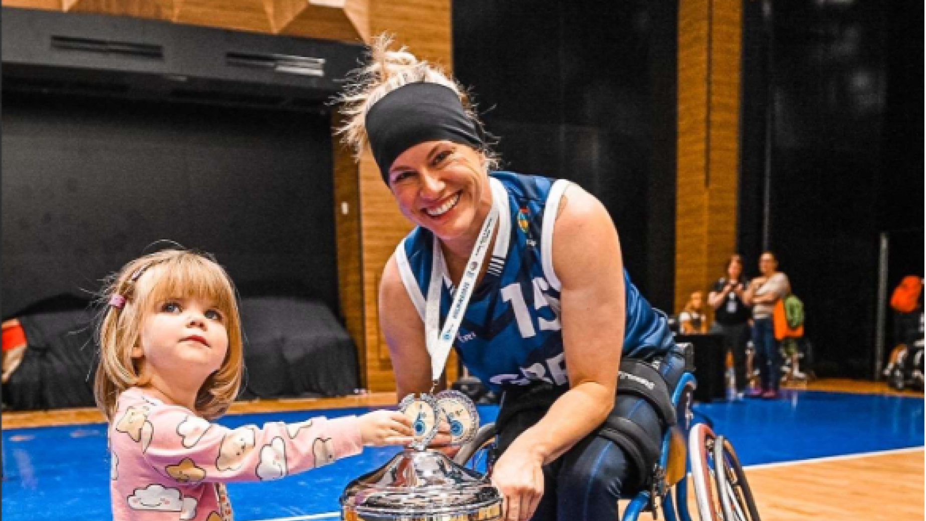 Robyn Love with her daughter and a trophy