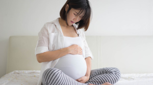 pregnant woman sitting down