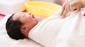 How to swaddle a baby safely