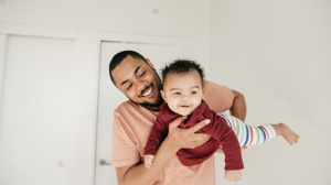 dad playing with baby