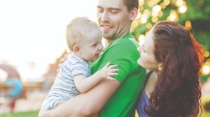 Parents holding a baby