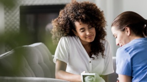 Pregnant mum talking to friend