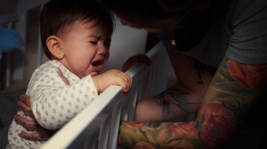 Baby crying in cot at night