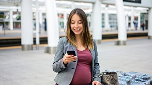 Pregnant woman at train station