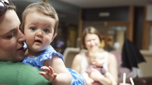 Mum holding her baby at a Baby Cafe