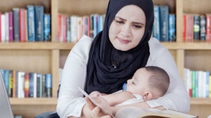 Parent studying with a baby