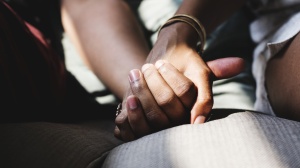 Couple holding hands