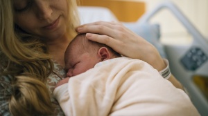 Woman with newborn baby