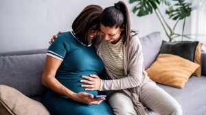 Pregnant couple feeling tummy