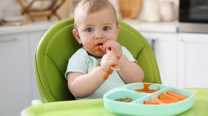 Baby eating solid food