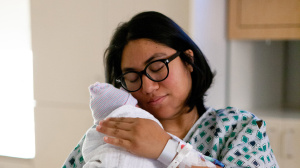 Mum holding her baby in a hospital