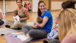 Group of mums and babies at yoga class