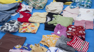 Baby clothes on a seller's table