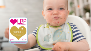 Baby with bib in a highchair