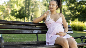 Pregnant woman or birthing person in park
