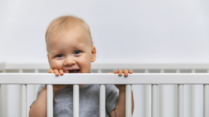 Toddler in cot