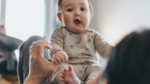 Baby on parent's knees