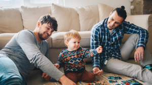 Fathers playing with a child