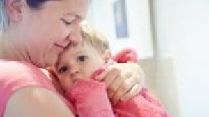 Mother holding toddler