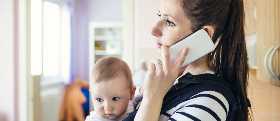 Mother with baby on phone