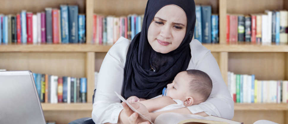 Woman reading with baby