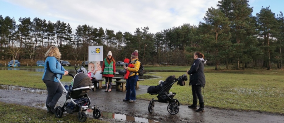 Parents walking their babies on strollers