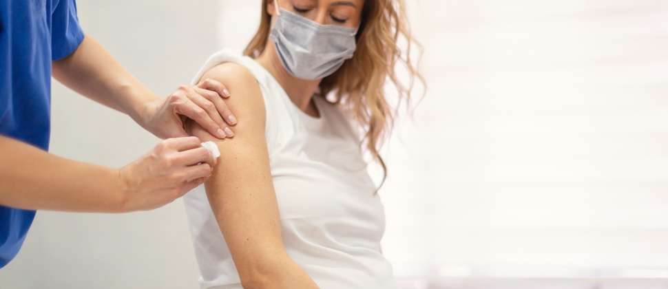 Pregnant woman getting vaccinated