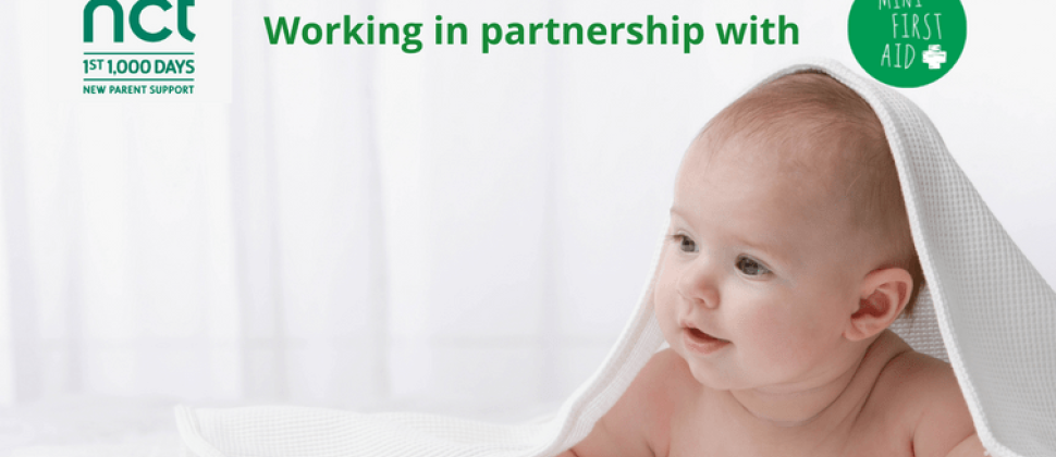 picture of a baby under a towel with the nct logo and the words "working in partnership with mini first aid- baby and child first aid classes"