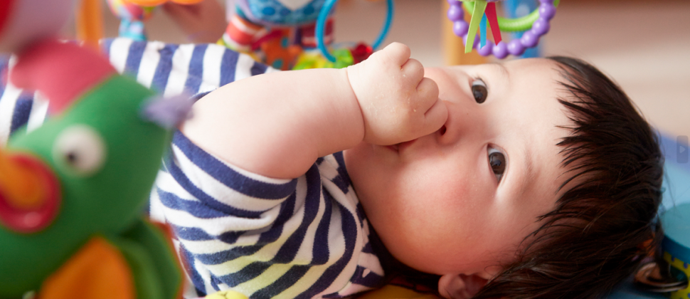 Baby on play mat