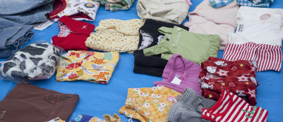 Baby clothes on a seller's table