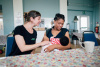 Breastfeeding counsellor supporting a mother with feeding